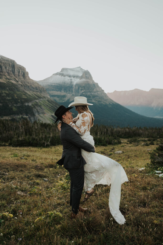 Couple in front of beautiful mountains in Glacier National Park