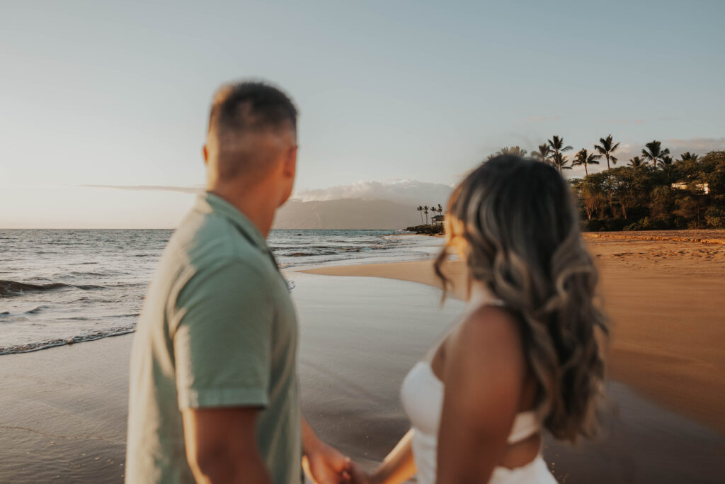 Couple looking at beautiful beach views in Maui, Hawaii.