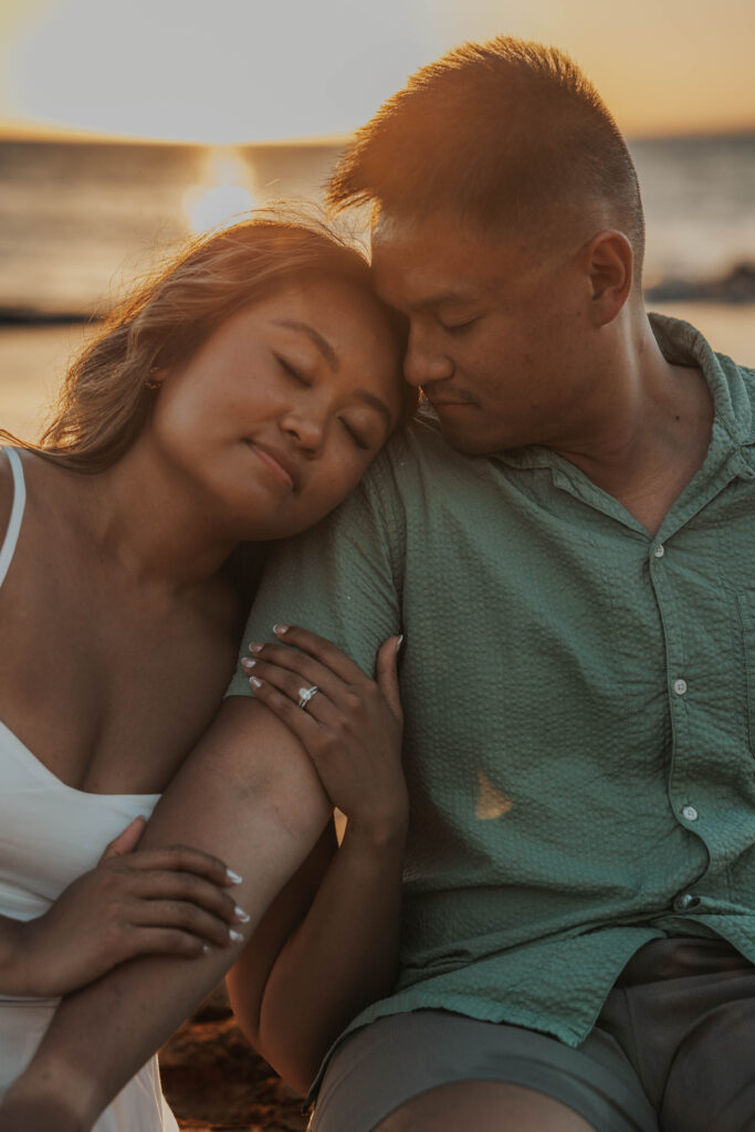 Sunset photoshoot of couple on Po'olenalena Beach, Maui.