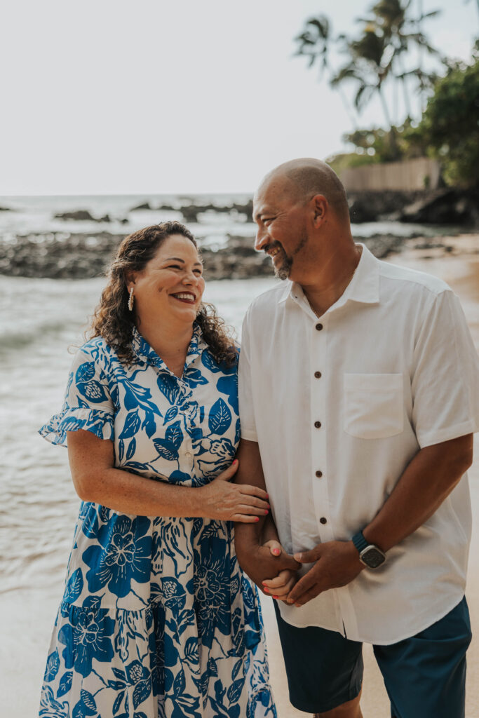 Couple smiling to each other on a Hawaii beach