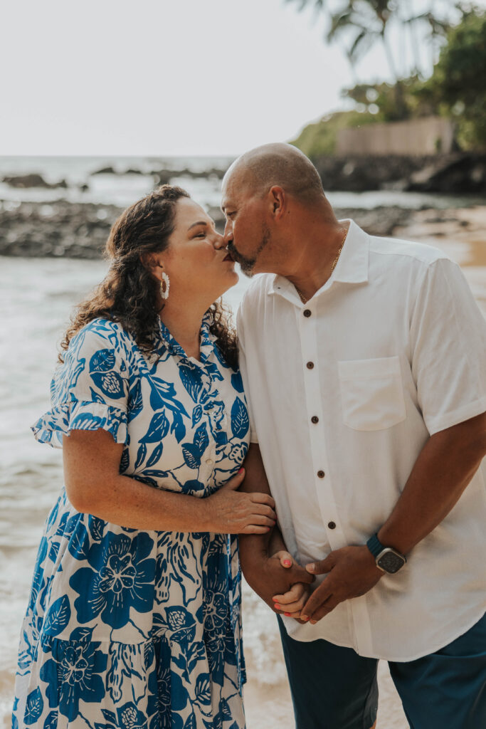 Couple kissing on a beach in Hawaii