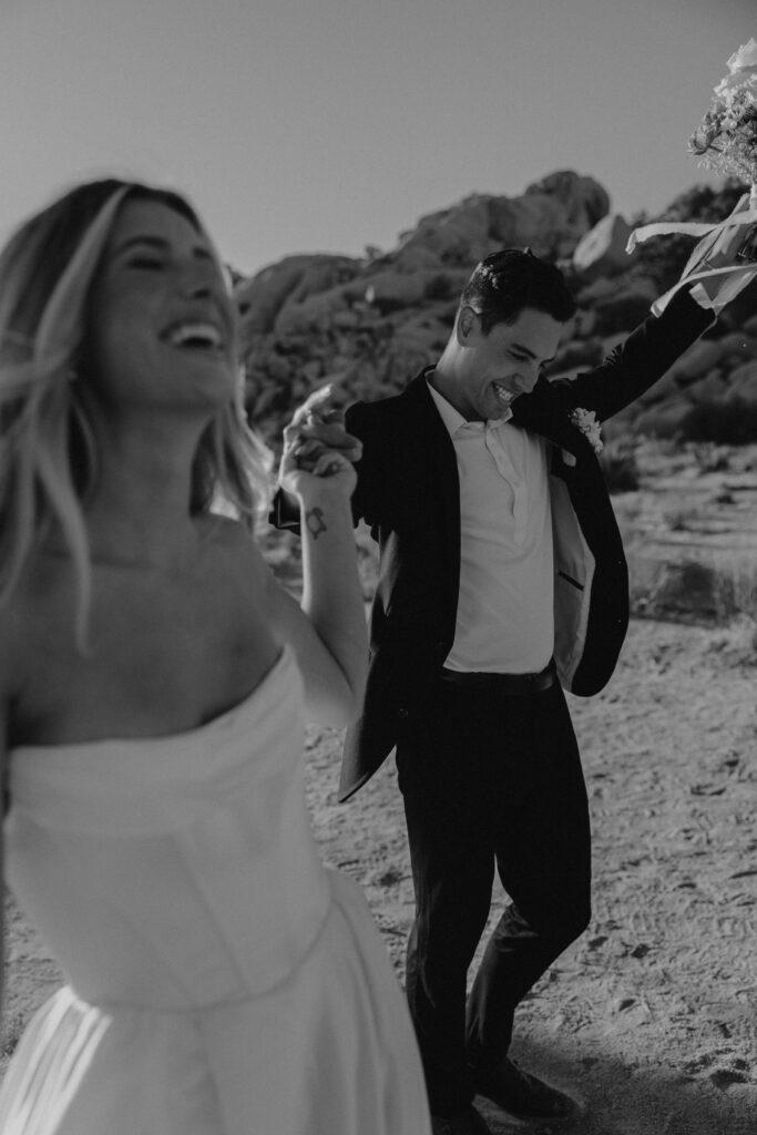 Couple having fun during their elopement in Joshua Tree