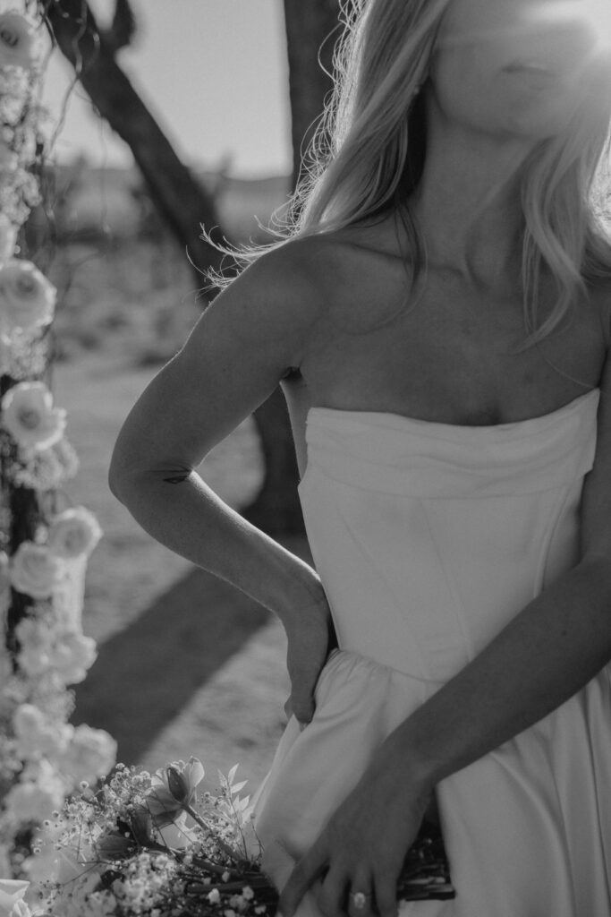 Black and white image of bridal details in the desert