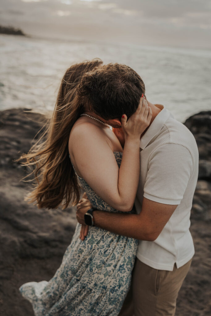 Couple kissing on Ho'okipa Beach in Maui, Hawaii! 