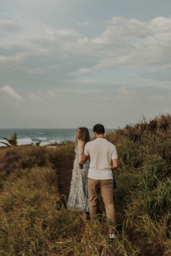 Couple running together on a Maui beach