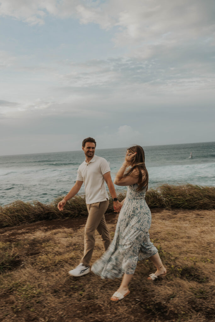 Couple running together on a Maui beach