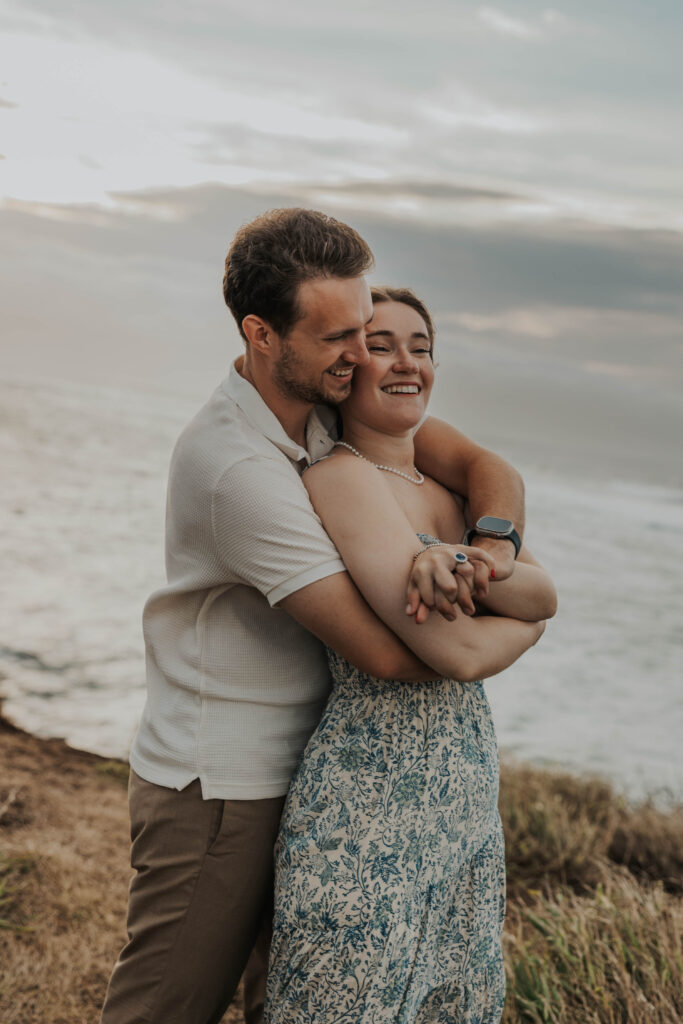 Couple hugging on a beach in Maui, Hawaii