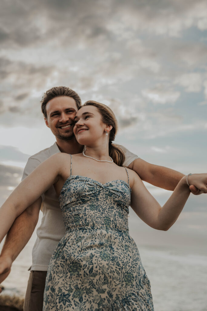 Couple enjoying their engagement photoshoot on a Maui beach