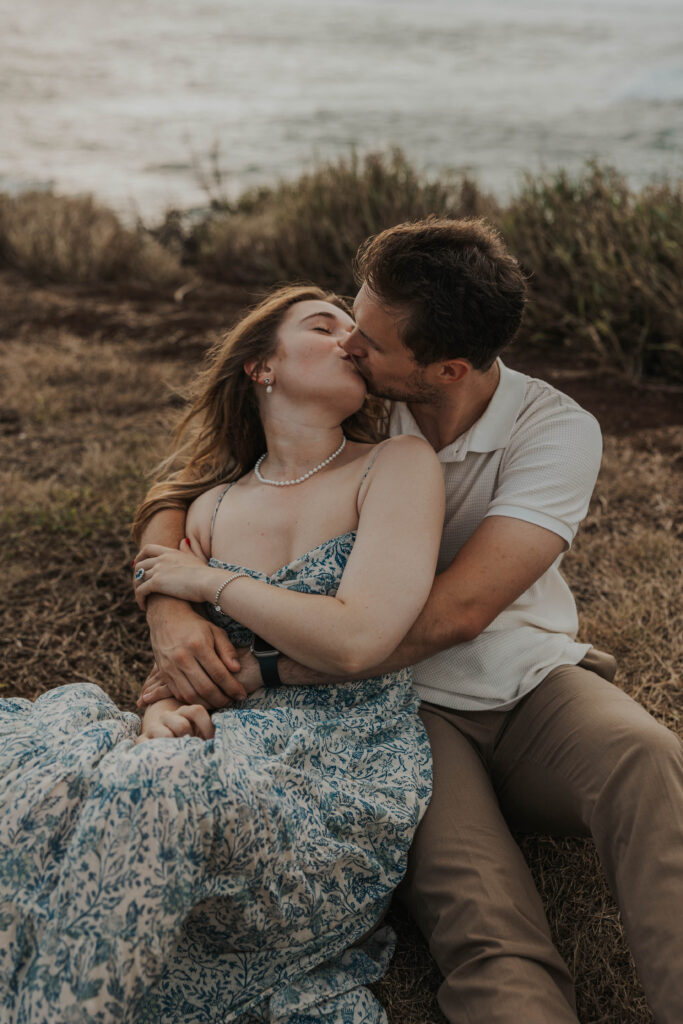 Couple kissing on a beach during their engagement photoshoot in Maui, Hawaii 