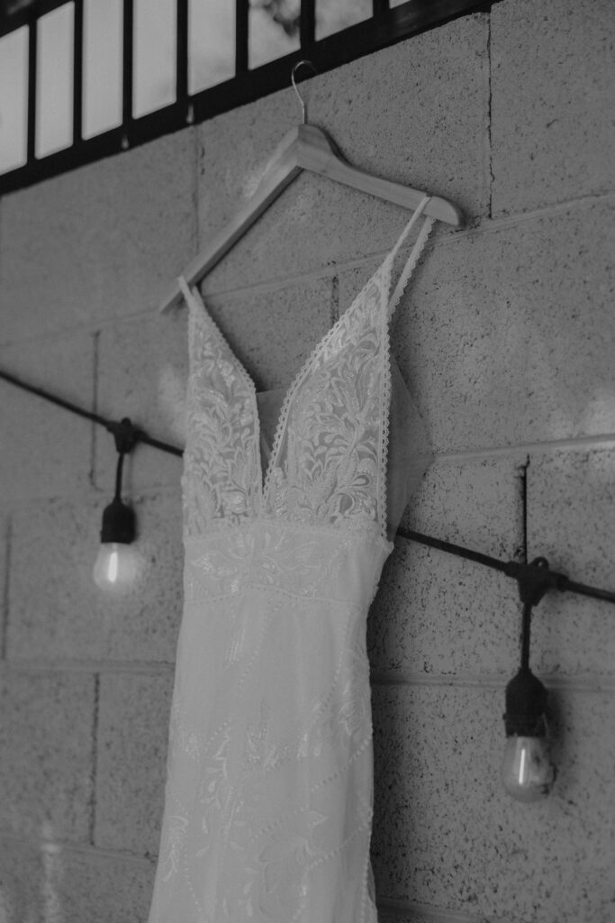 Bride's wedding dress hanging at a wedding venue in Arizona