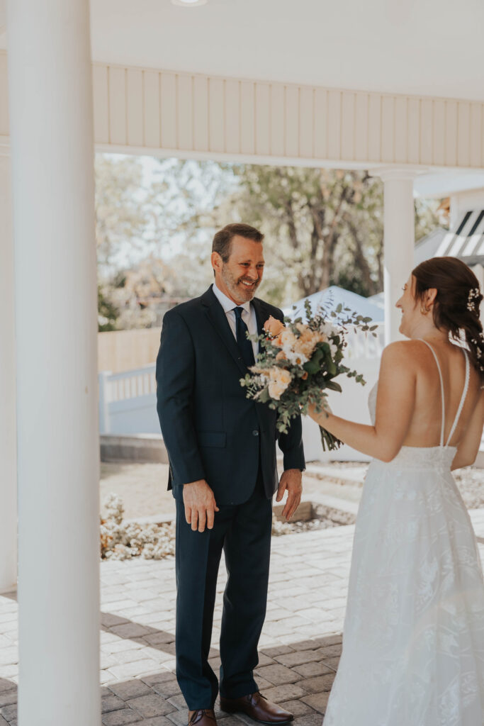 Dad and bride doing a first look