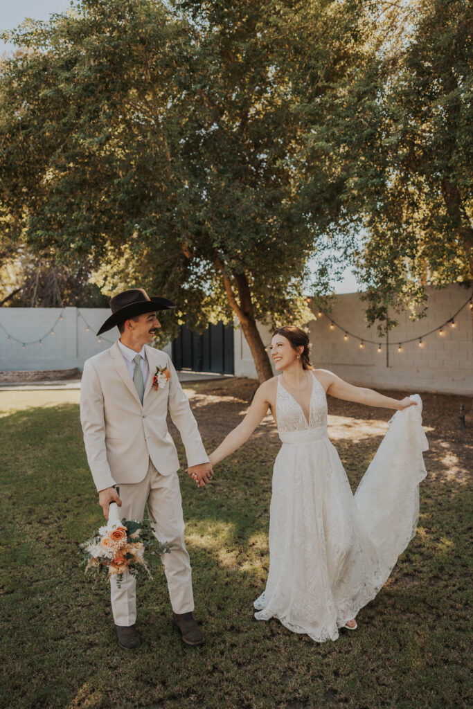 Couple enjoying their wedding in the backyard