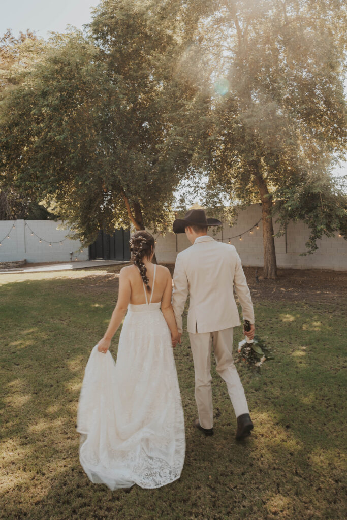 Couple enjoying their wedding in the backyard