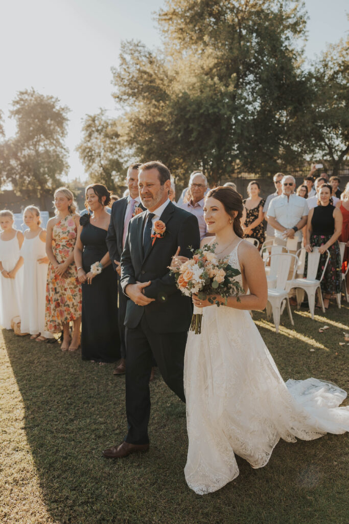 Dad walking bride down the aisle