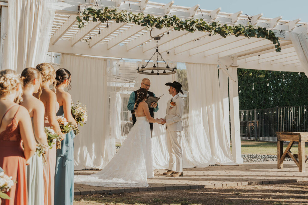 Couple during their backyard wedding ceremony