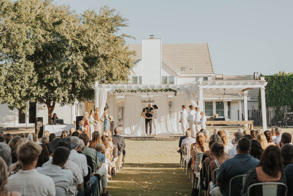 Couple during their backyard wedding ceremony