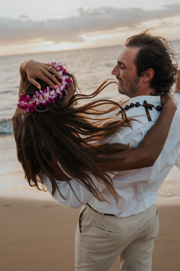 Couple having fun on a beach in Hawaii