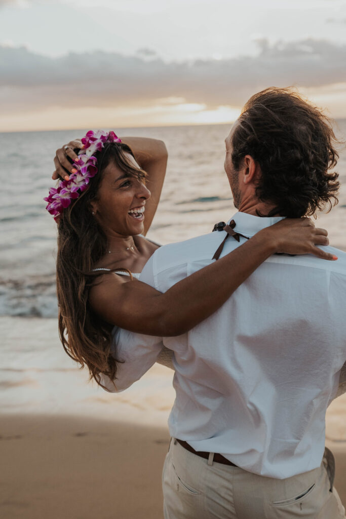 Playful couple during a sunset on a beach in Maui, Hawaii