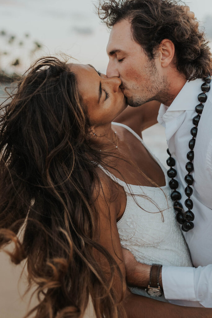 Couple kissing during their Maui elopement 