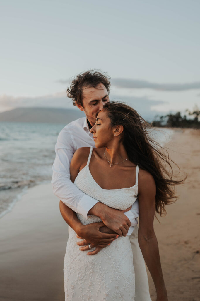 Couple enjoying their elopement on a beach in Hawaii