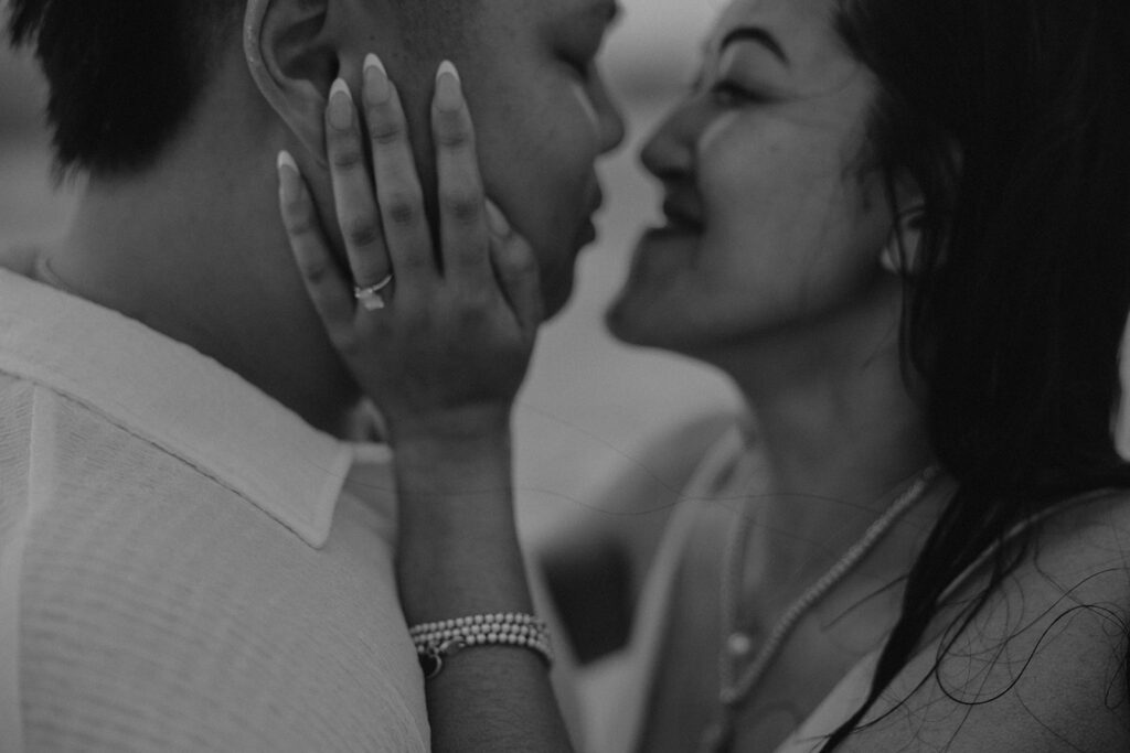 playful engagement pictures on the beach