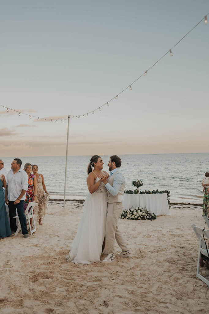 bride and groom first dance on the beach