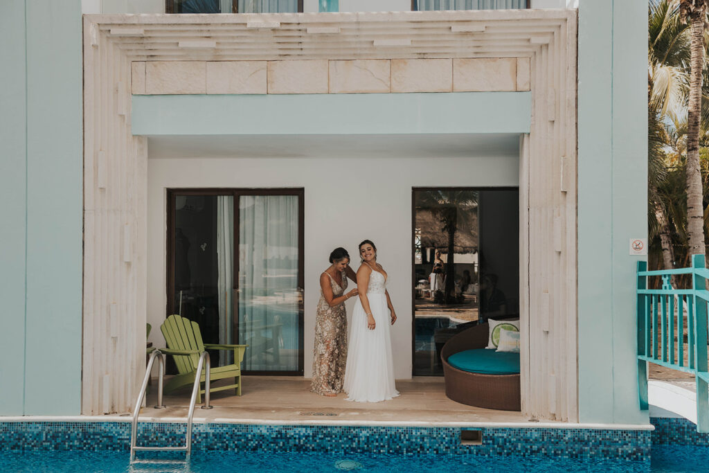 bride getting ready for beach wedding in cancun