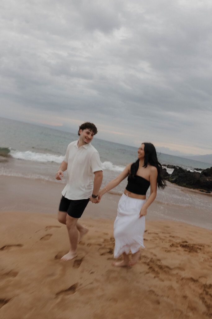 documentary style engagement photos in hawaii on the beach
