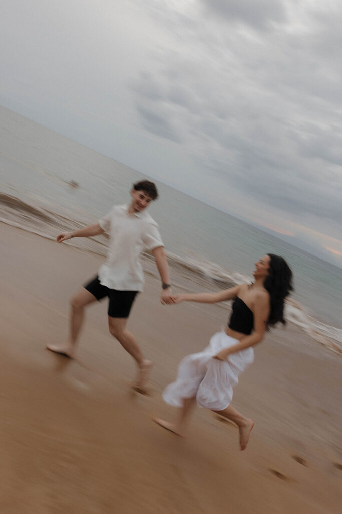 documentary style engagement photos in hawaii on the beach