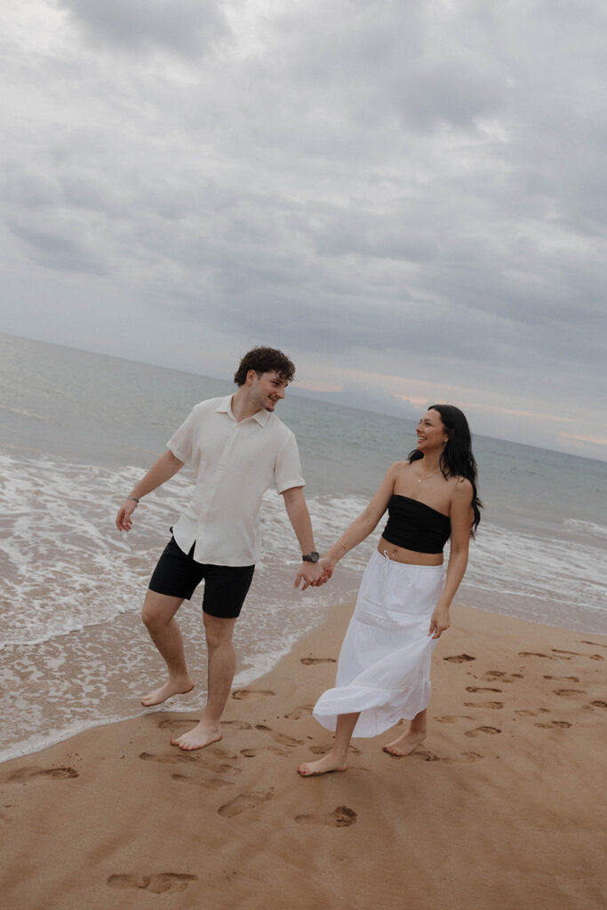 documentary style engagement photos in hawaii on the beach