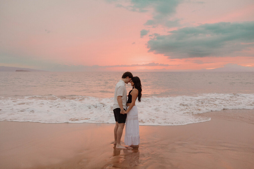 vibrant sunset couple photos in maui on the beach