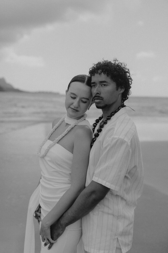 playful bride and groom photos on the beach