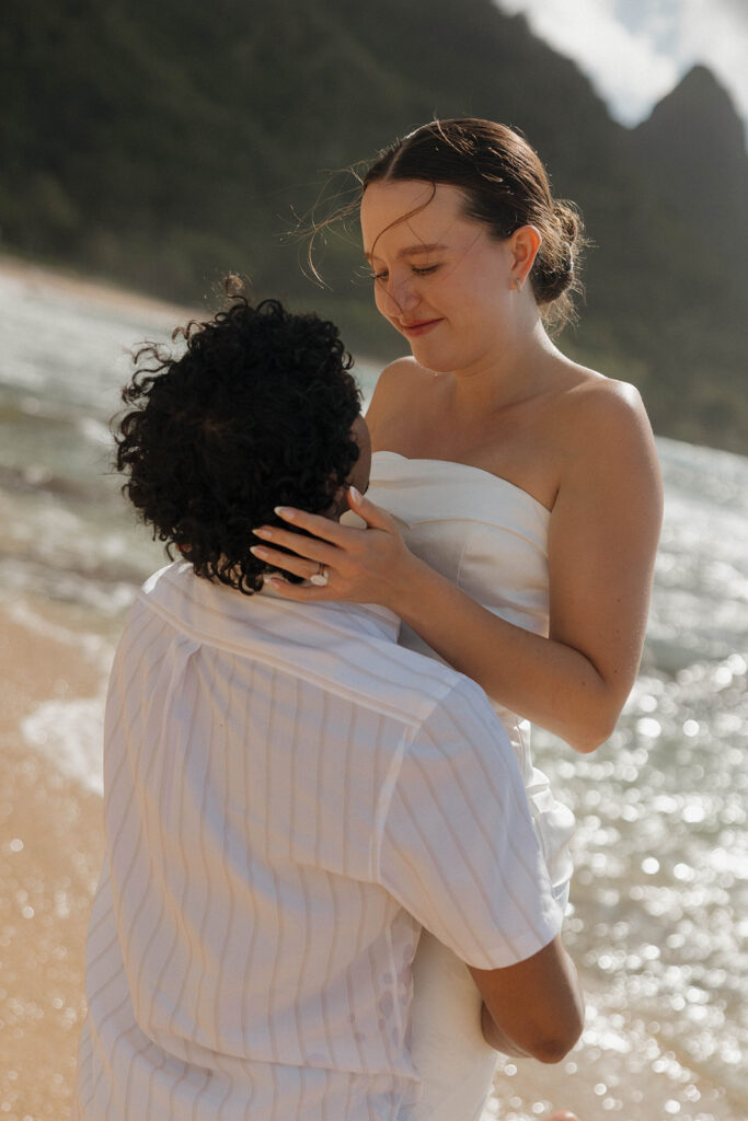 playful bride and groom photos on the beach