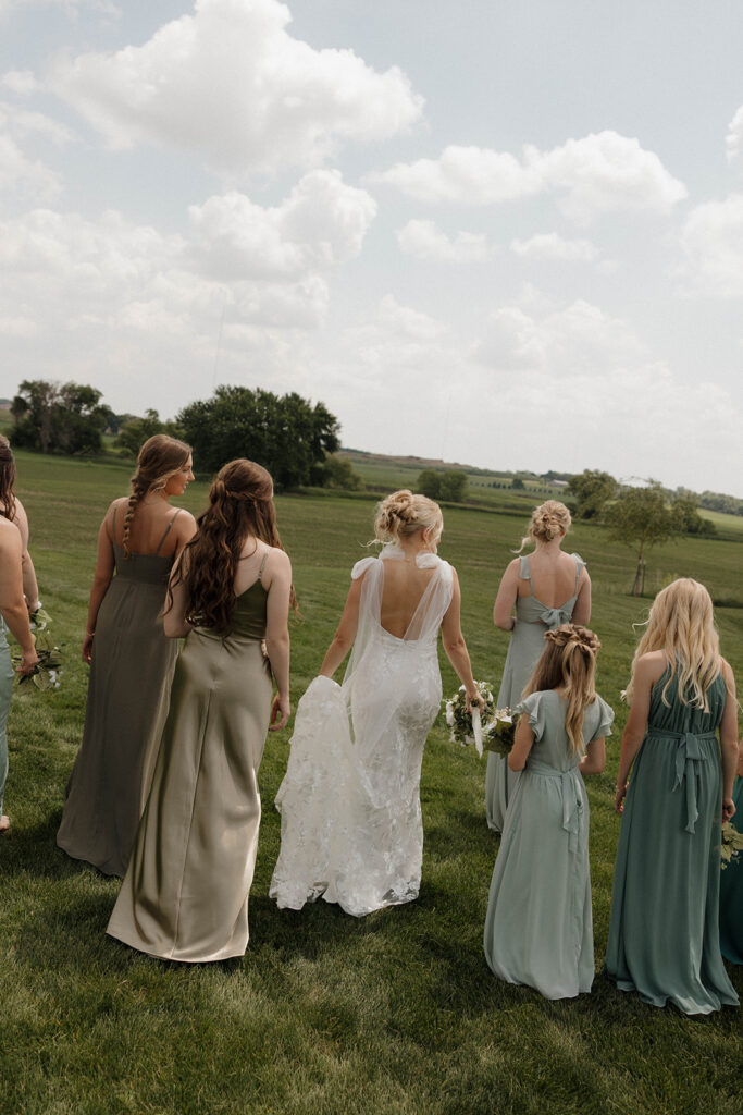bride smiling and laughing with her bridesmaids