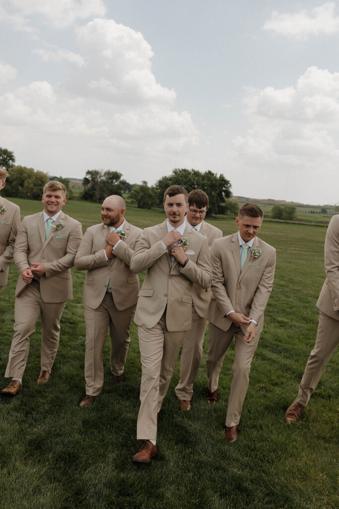 candid groomsmen photos with neutral colors
