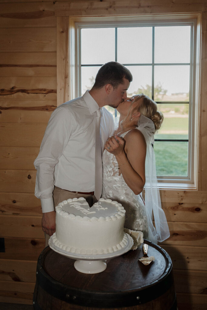 bride and groom cutting the wedding cake