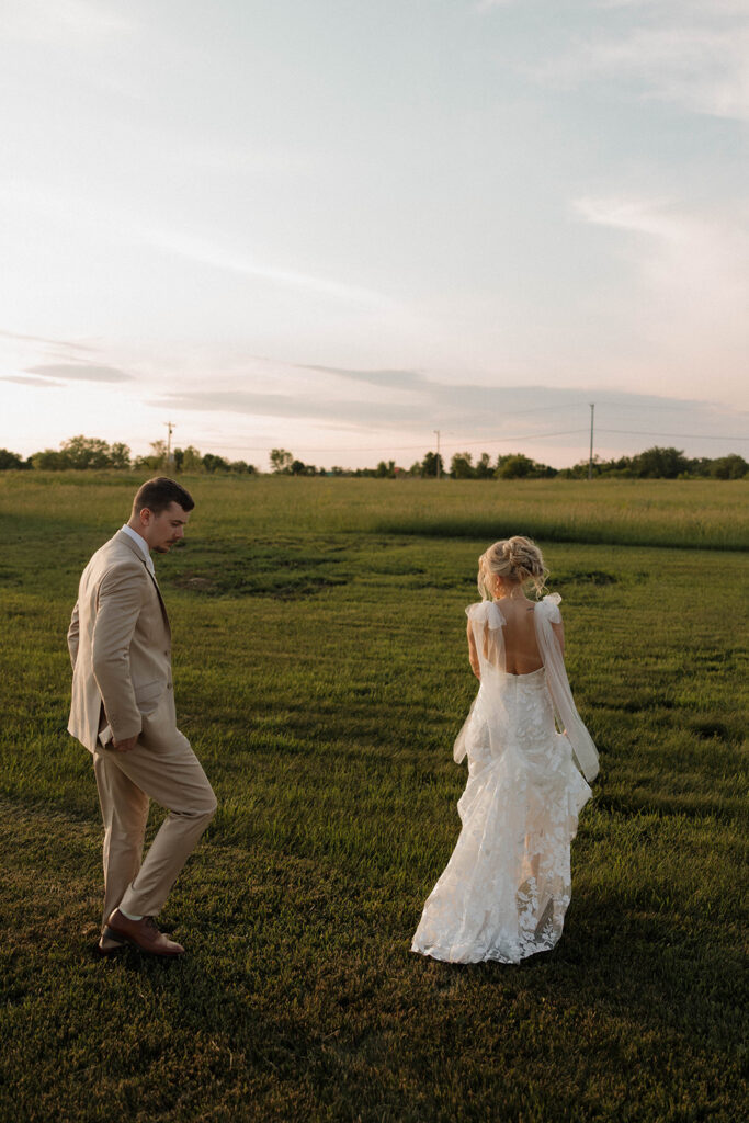 golden hour wedding photos with the bride and groom after ceremony at riverview barn