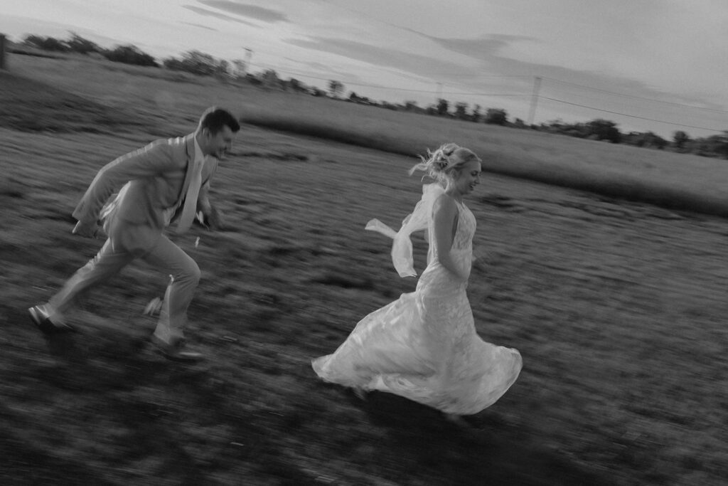 candid running photos bride and groom at riverview barn