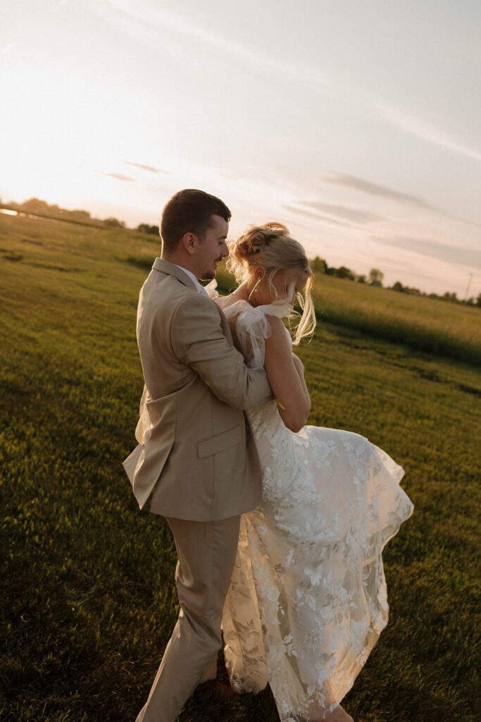 golden hour wedding photos with the bride and groom after ceremony at riverview barn