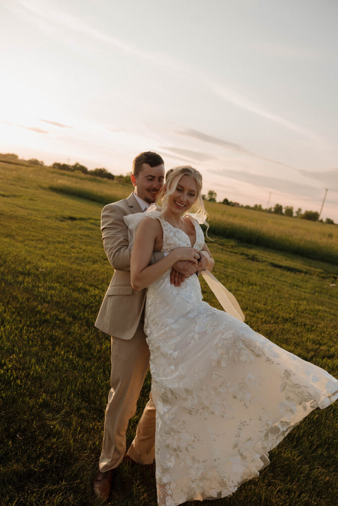 golden hour wedding photos with the bride and groom after ceremony at riverview barn