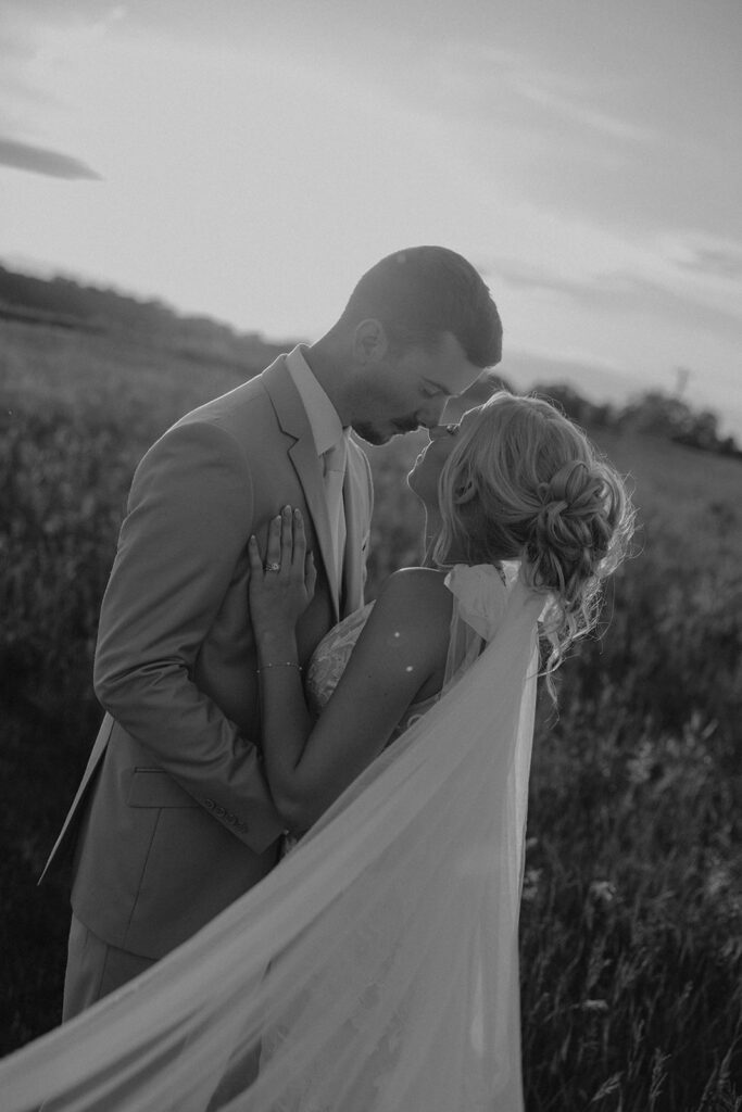 sunset wedding pictures with the bride and groom at riverview barn
