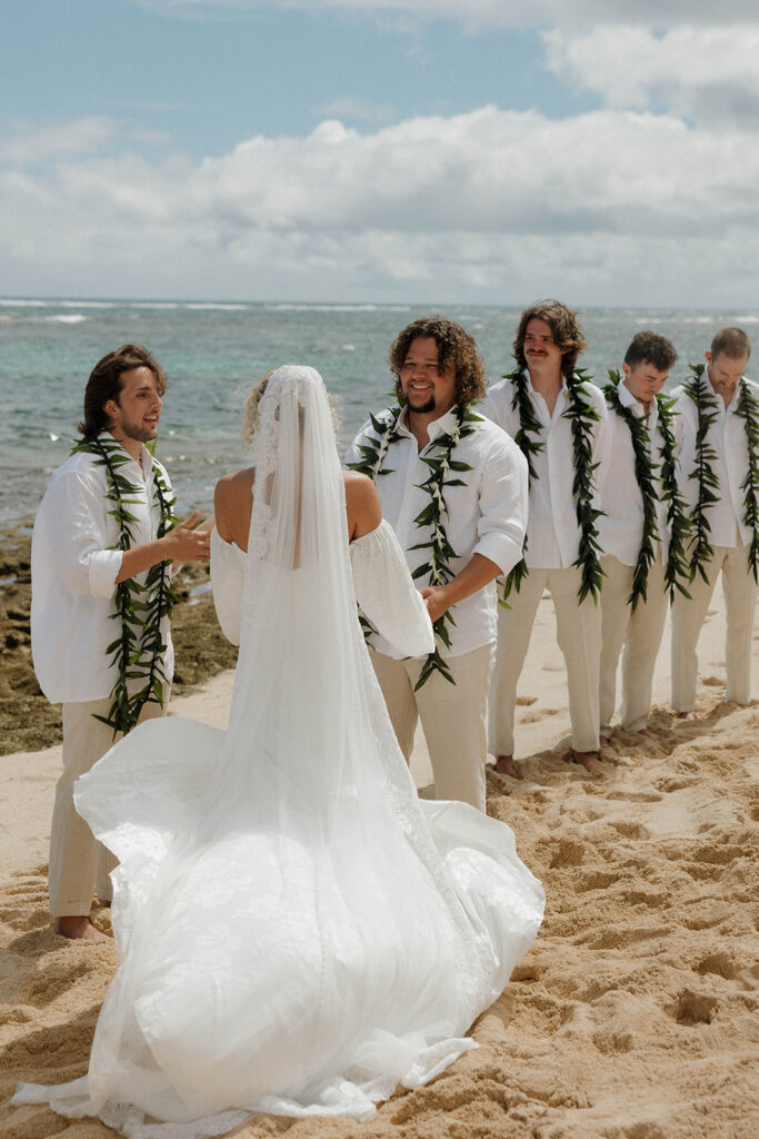pastel beach wedding in oahu with leis and tropical colors
