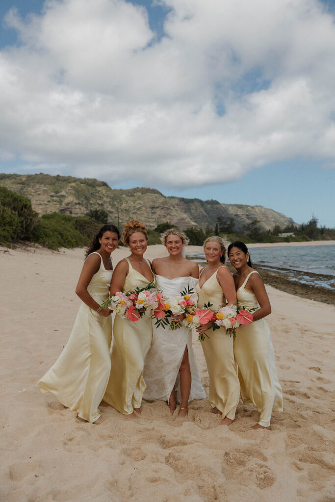 pastel yellow bridesmaid dresses with pink flowers