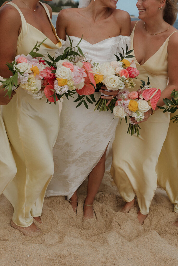 pastel yellow bridesmaid dresses with pink flowers