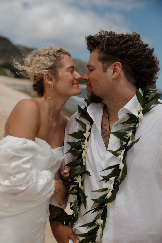 bride and groom holding hands and running on the beach