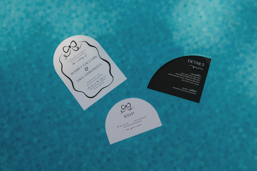 wedding invitations in the pool