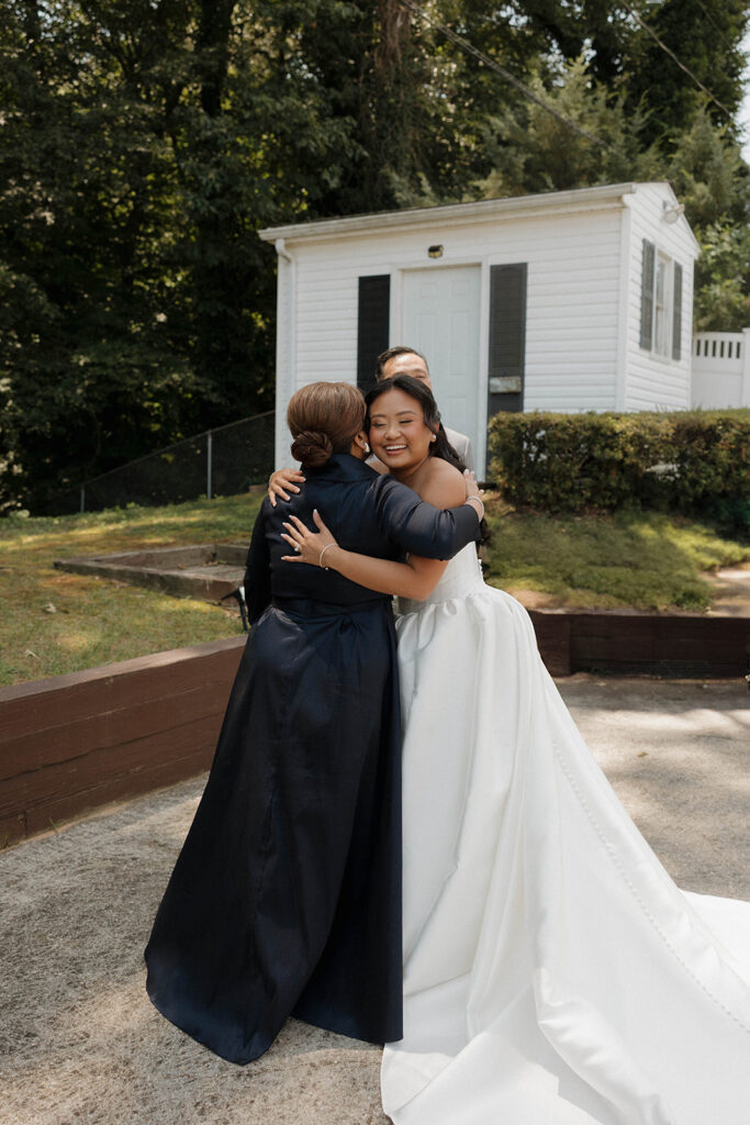 mom and bride getting ready for wedding ceremony