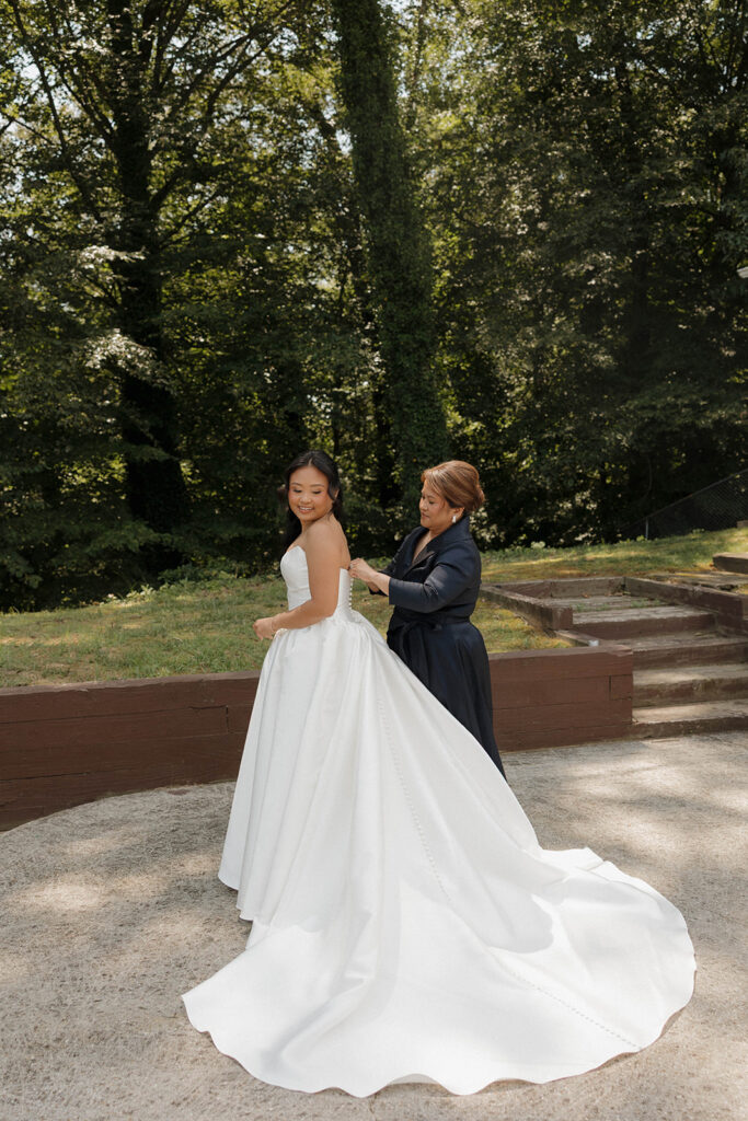 mom and bride getting ready for wedding ceremony