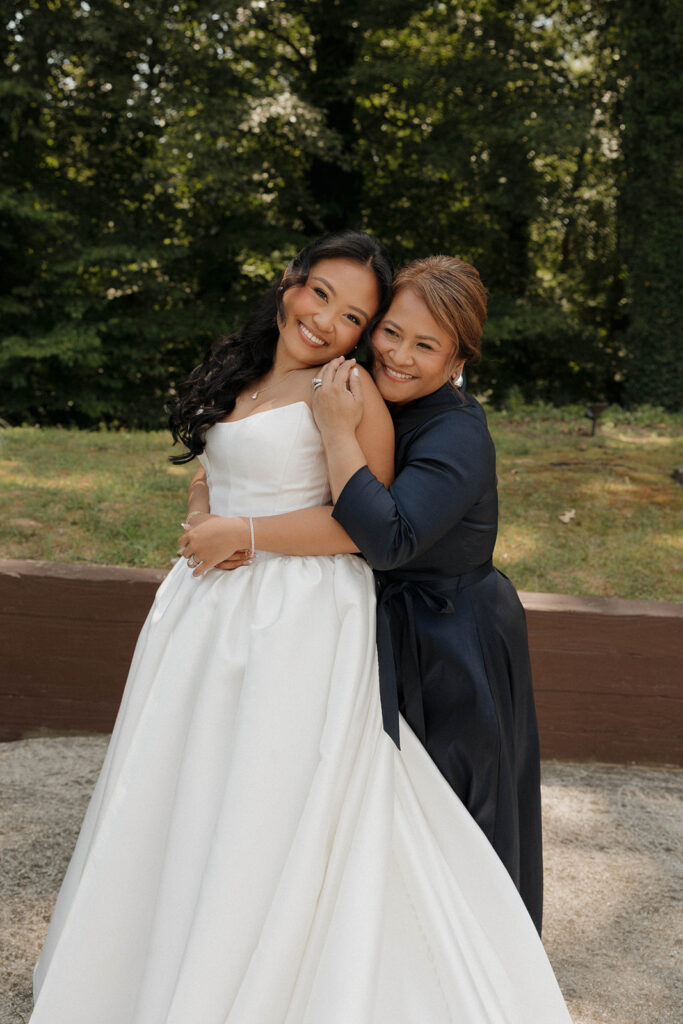 mom and bride getting ready for wedding ceremony