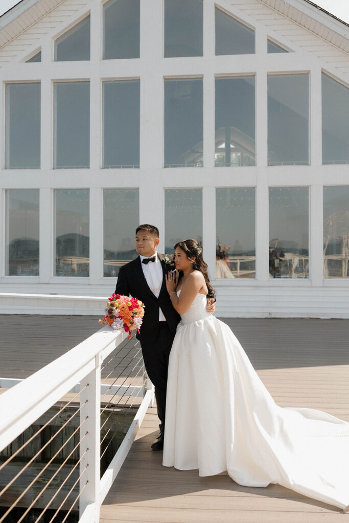 romantic bride and groom portraits by the lake in maryland